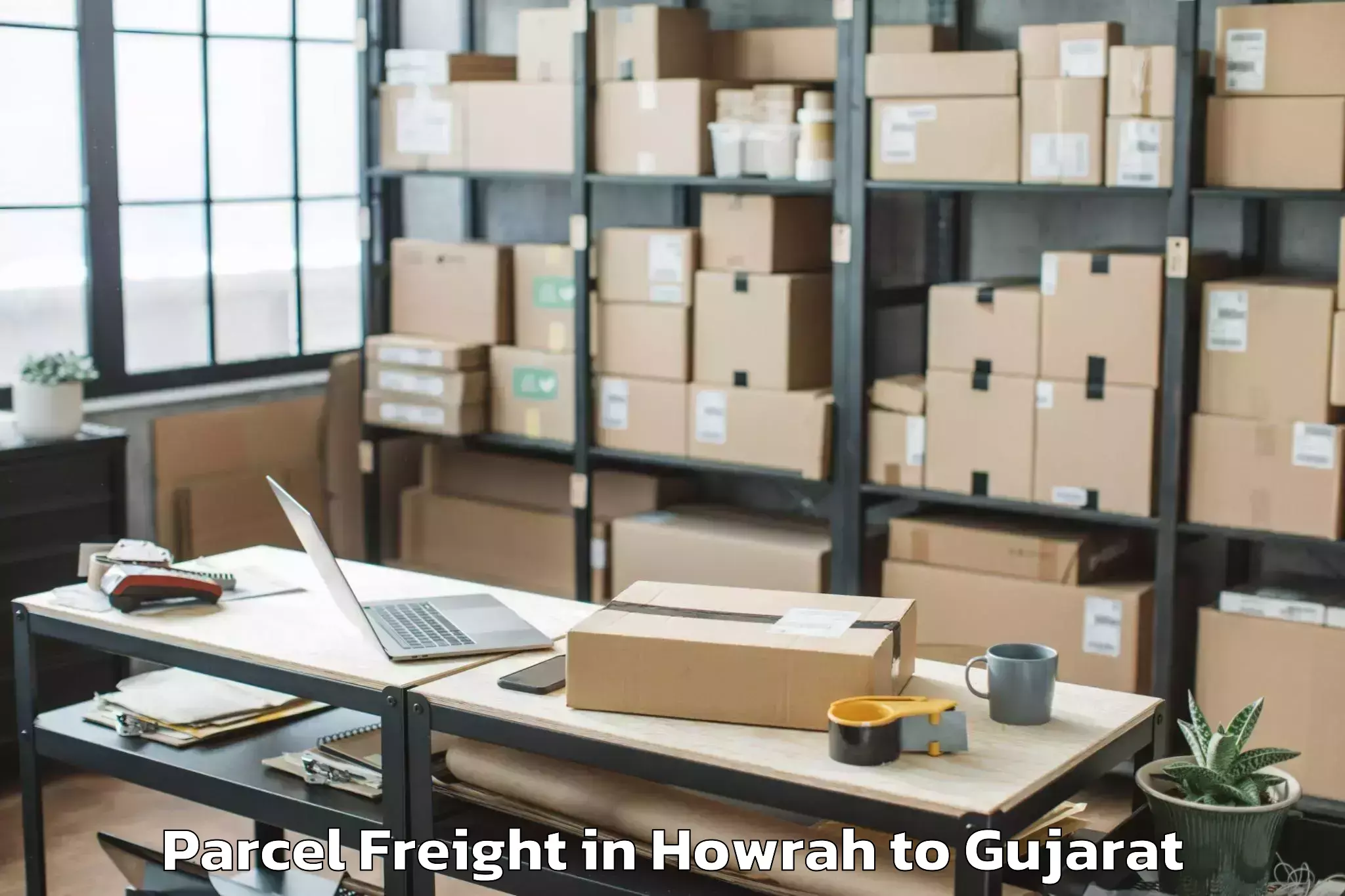 Book Howrah to Songadh Parcel Freight Online